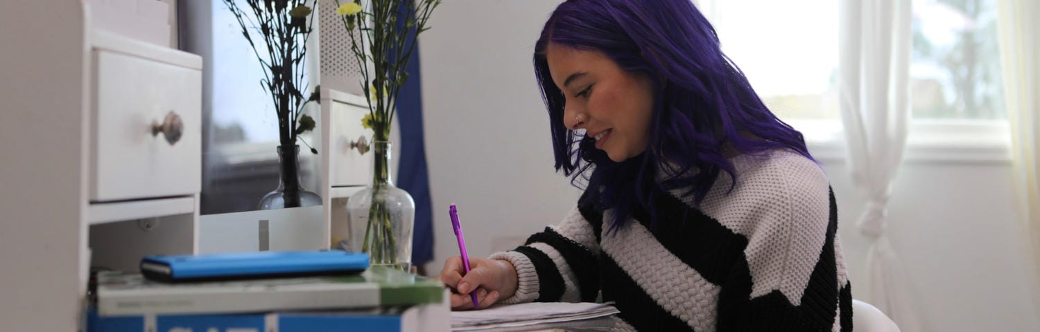 Student taking notes