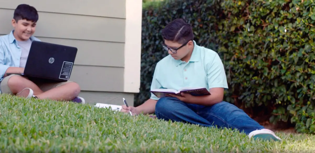 Students doing homework together at home